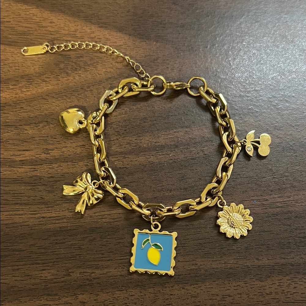 Gold plated stainless steel multi charm bracelet